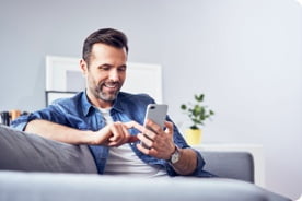 step-1-man-on-sofa-with-phone